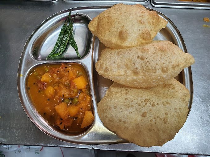 A photograph of Gujrati Food & Coffee Shop