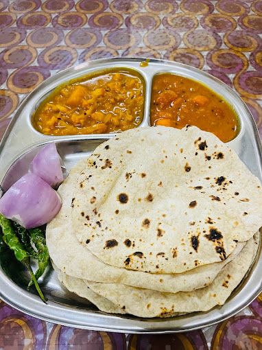A photograph of Gujrati Food & Coffee Shop