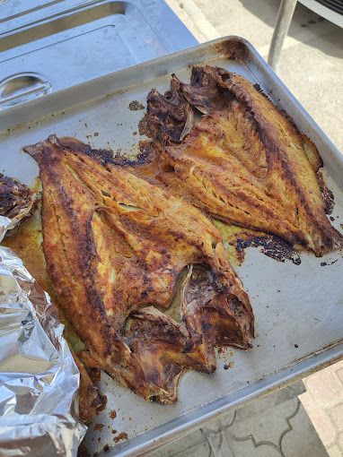A photograph of Restaurant grill fish and Yemeni food