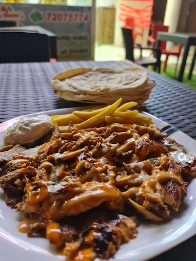 A photograph of Zoox shawarma and grills